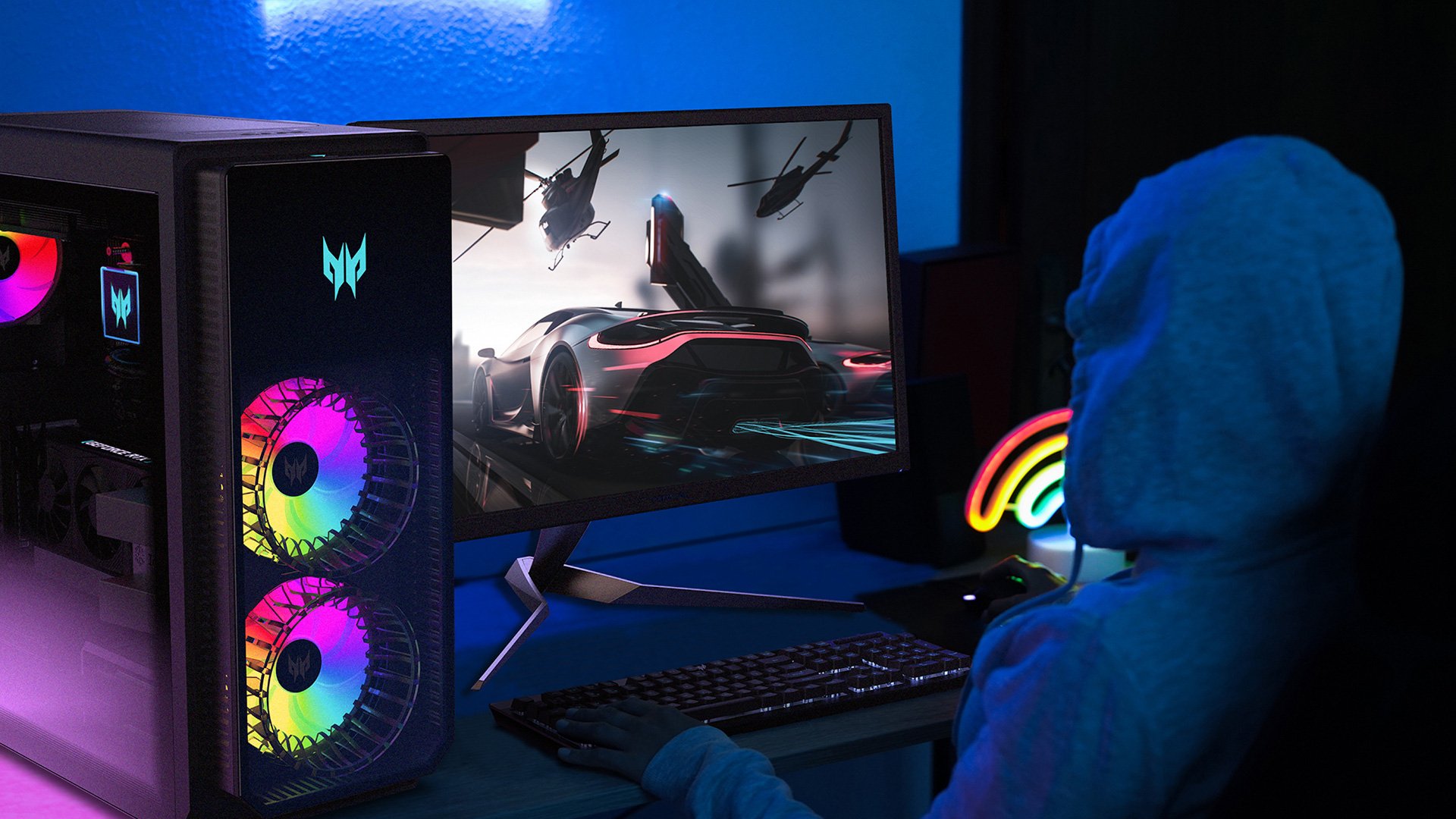 Acer Predator Orion 7000 gaming desktop on a desk next to a monitor