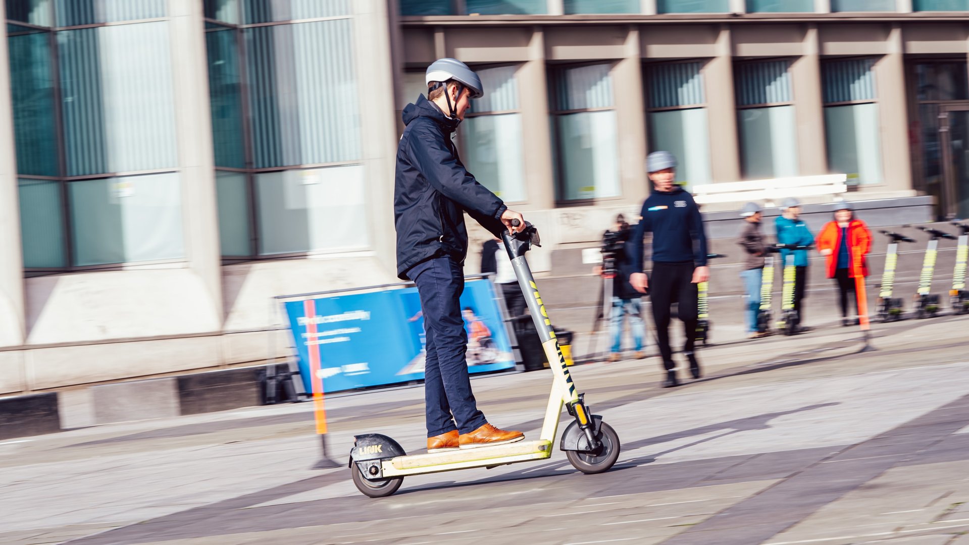 Man riding a LINK Superpedestrian electric scooter