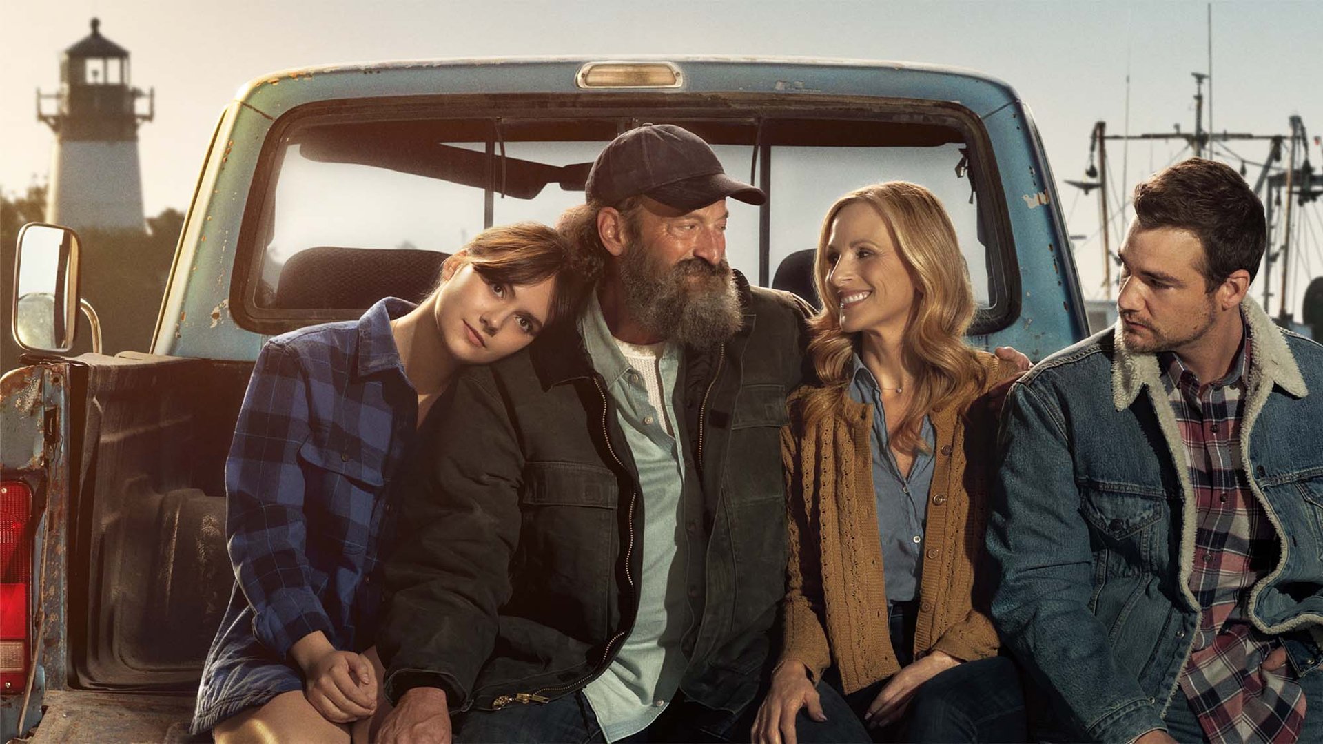 Emilia Jones, Troy Kotsur, Marlee Matlin and Daniel Durant sit in the back of a van for the Apple TV Plus movie CODA