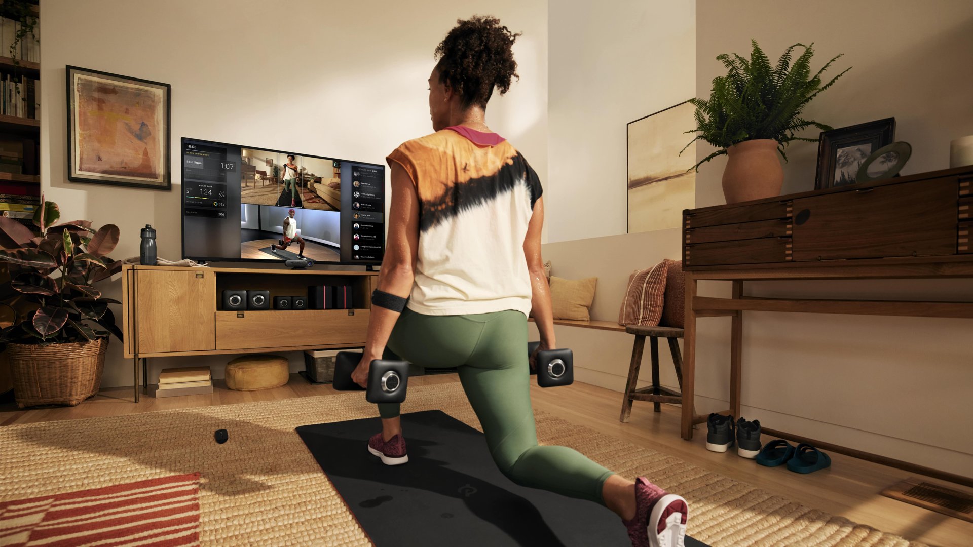 Woman using Peloton Guide in her living room