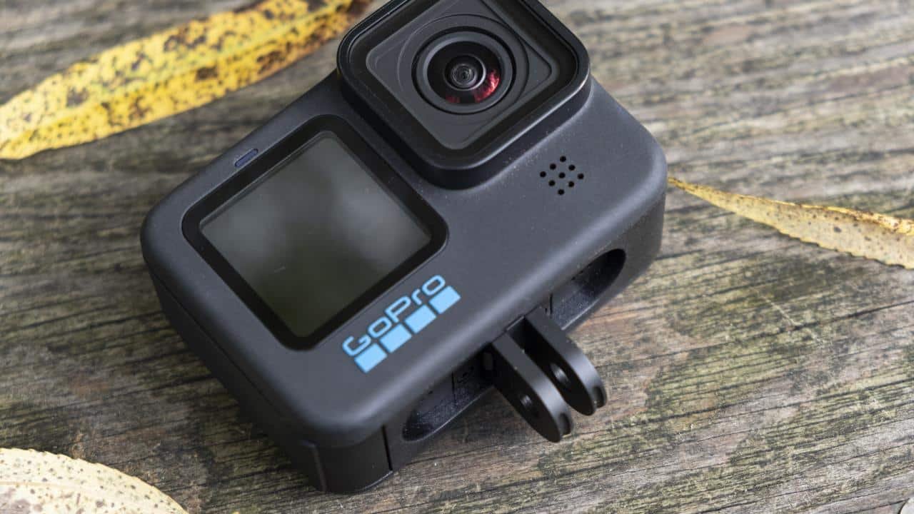 GoPro Hero 10 Black action camera rests on a wooden bench
