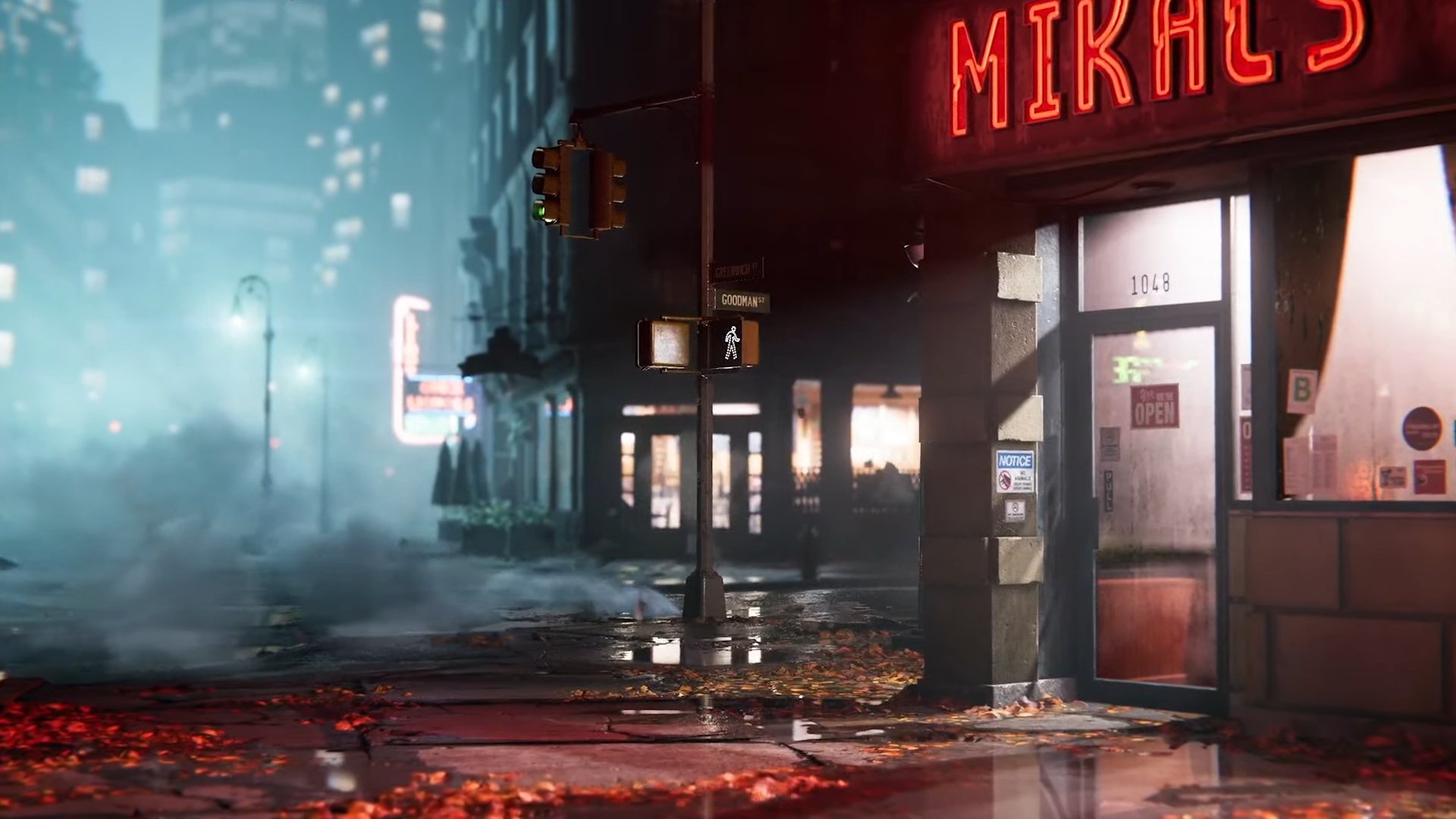 Captura de pantalla del tráiler de Marvel's Spider-Man 2 que muestra una esquina de una calle de Nueva York por la noche, iluminada por farolas y luces dentro de edificios