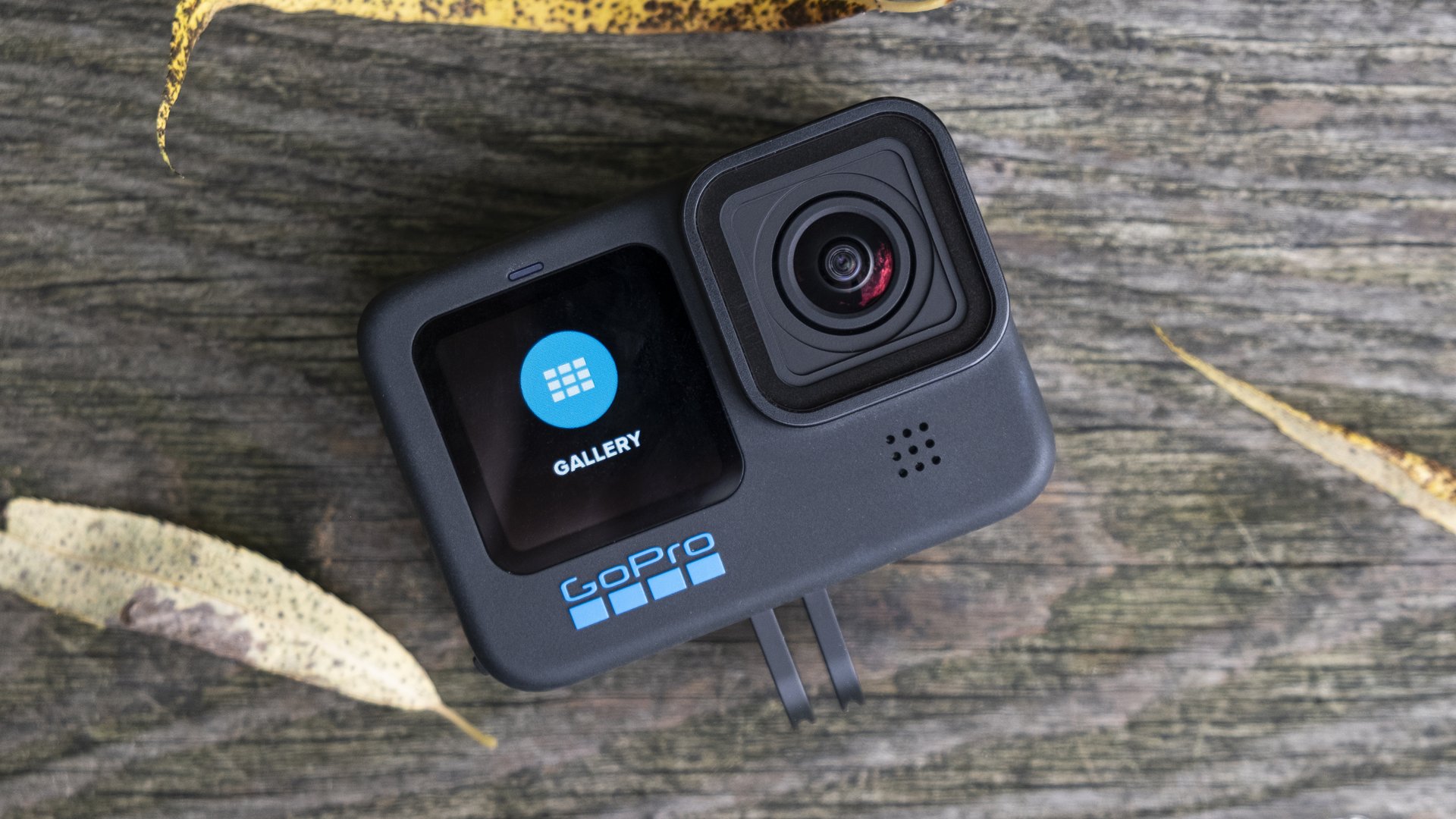 GoPro Hero 10 Black action camera rests on a wooden bench