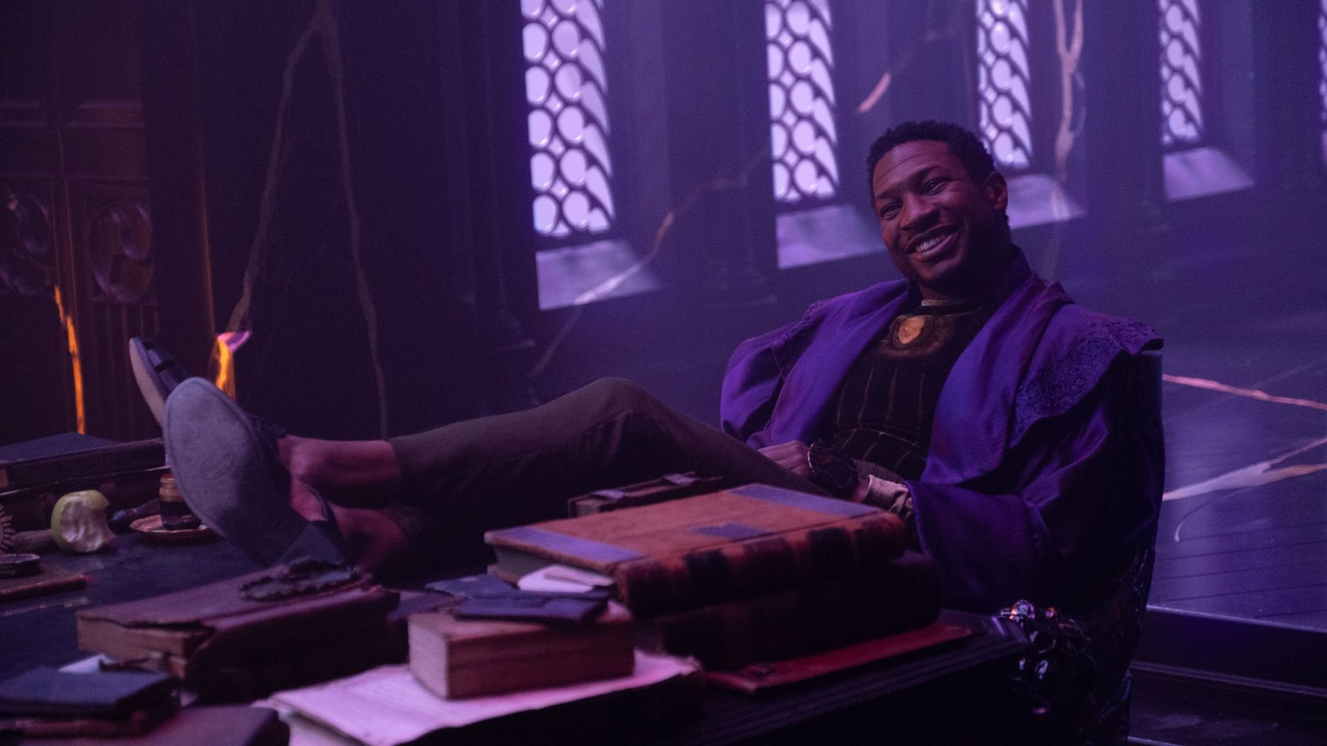 The one who stays smiles as he puts his feet up on a table in Loki episode 6
