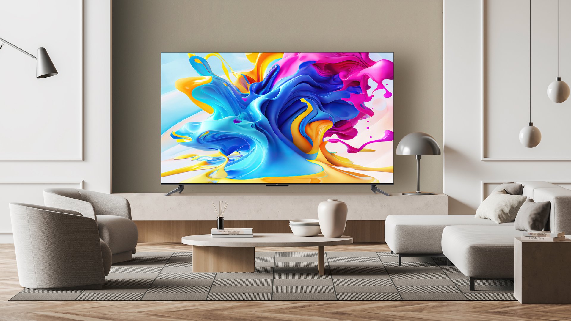Телевизор TCL C84 на белом фоне с яркими цветами краски на экране